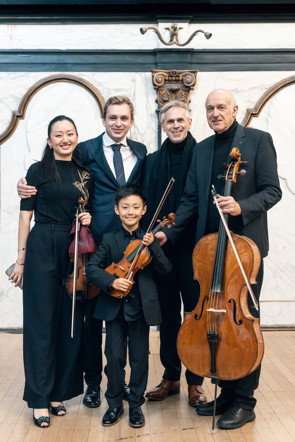 Karen Su, Ruben Plazier en musici van de Academy samen na afloop